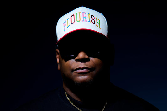 a cap with 'FLOURISH' text.